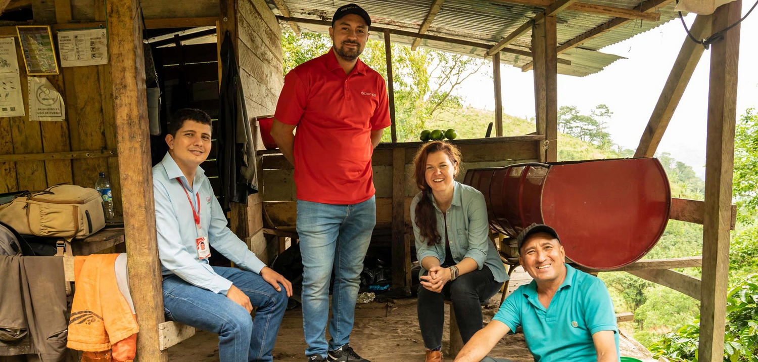 Westrock employees sit at an ethically sourced coffee farm.