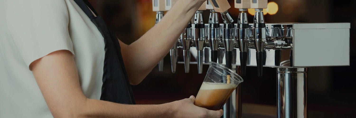 woman pouring coffee from a coffee machine